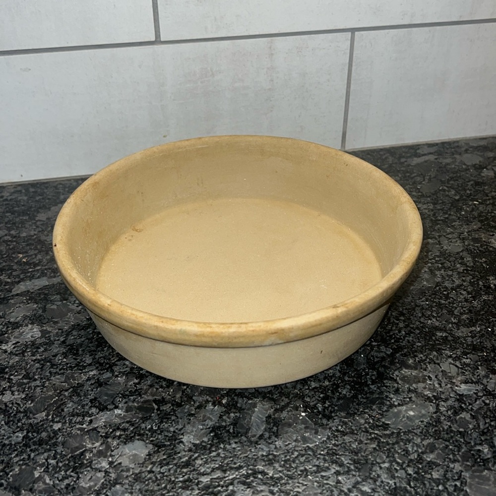 8” stone baker by Pampered Chef. Stone is partially seasoned since used.